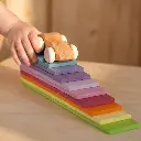 Agent_Image___Cinematic_close_up_of_a_small_child_s_hand_gently_poised_beside_a_simple_wooden_toy_ca.webp